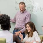 Northern Arizona U. has focused more on raising retention and graduate rates in recent years. Here, a math instructor at the college helps undergraduates.